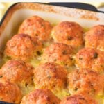 A baking dish with freshly baked chicken meatballs.