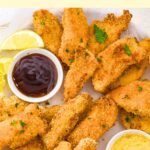 Top down view of a plate of crispy baked chicken tenders