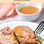 A plate of lamb slices with gravy.
