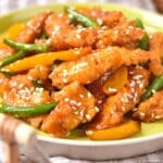 Up close shot of a plate of gluten-free honey sesame chicken.
