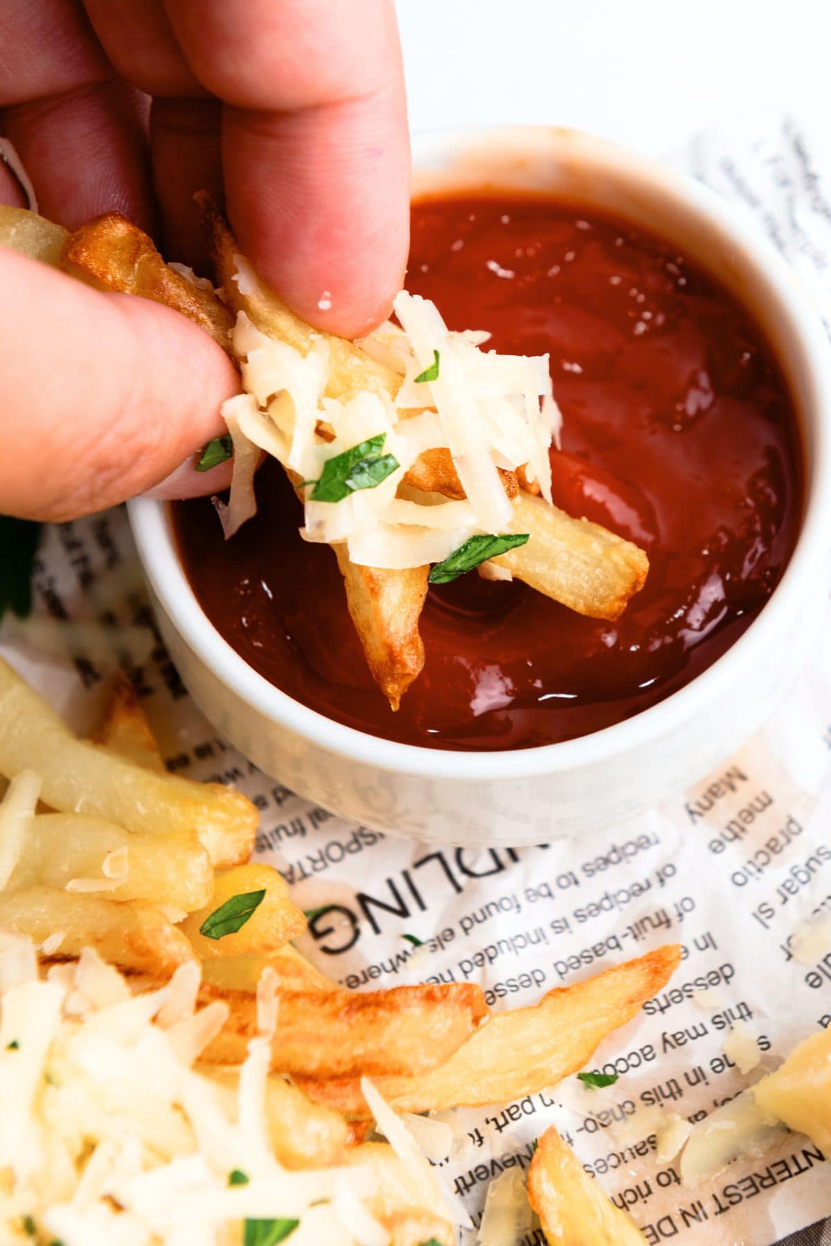 Dipping truffle fries into ketchup