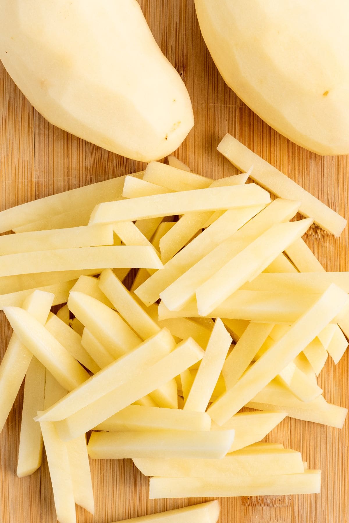 Cut potatoes on wooden board