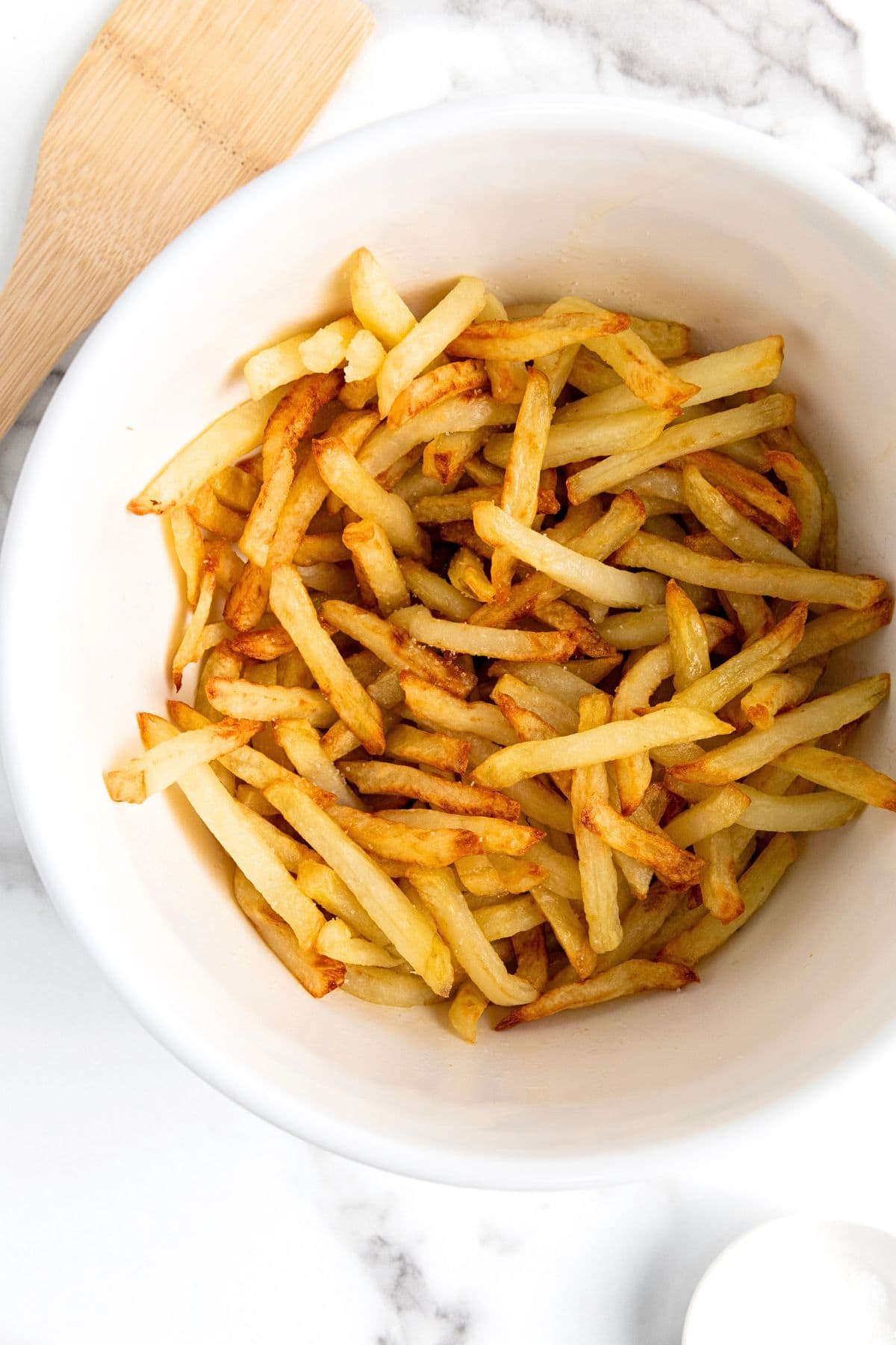 Cooked French fries in a bowl