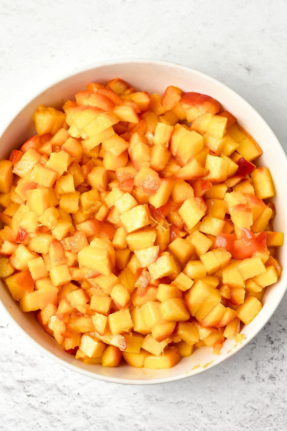 Peach Preserves Recipe Diced peaches in bowl