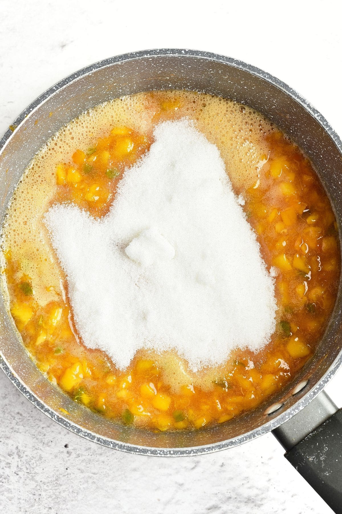 Homemade Peach Jalapeno Jam (Gluten-Free, Vegan) Sugar on top of peach and jalapeno mixture