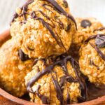 Up close view of peanut butter oatmeal balls drizzled in chocolate