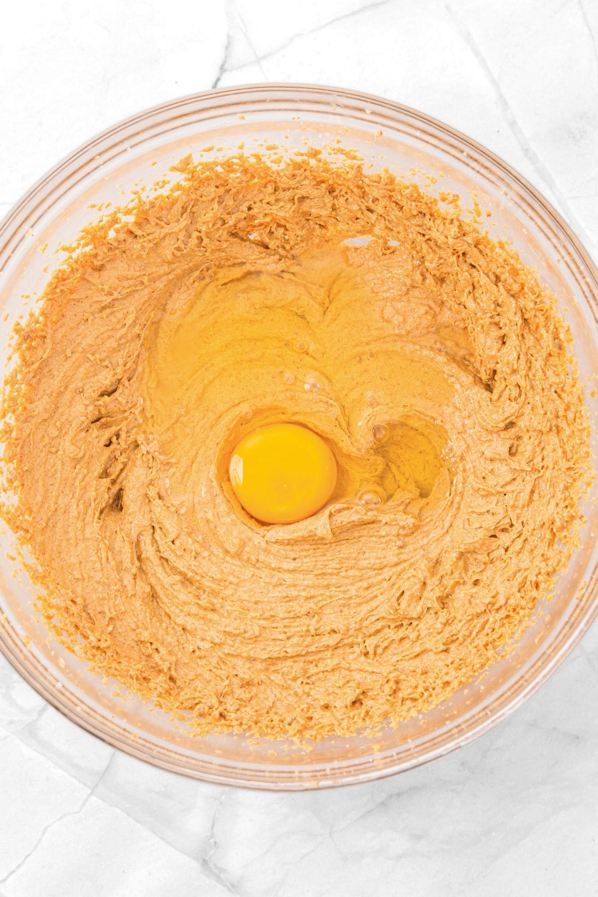 An egg in orange-brown batter.