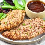 A plate of pecan-crusted chicken.