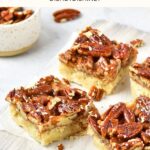 Pecan pie bars on wooden board