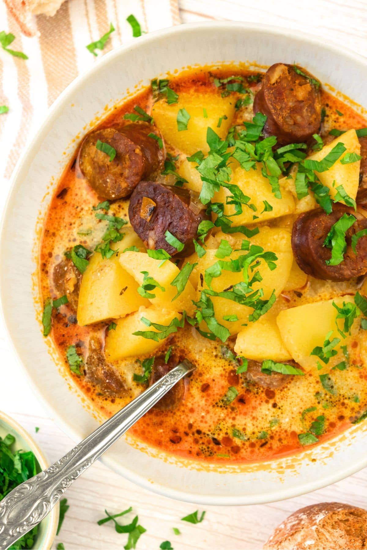 Top down view of a bowl of potato and chorizo soup.