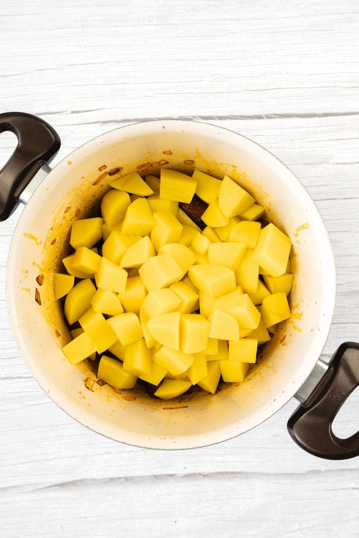 A pot with diced potatoes