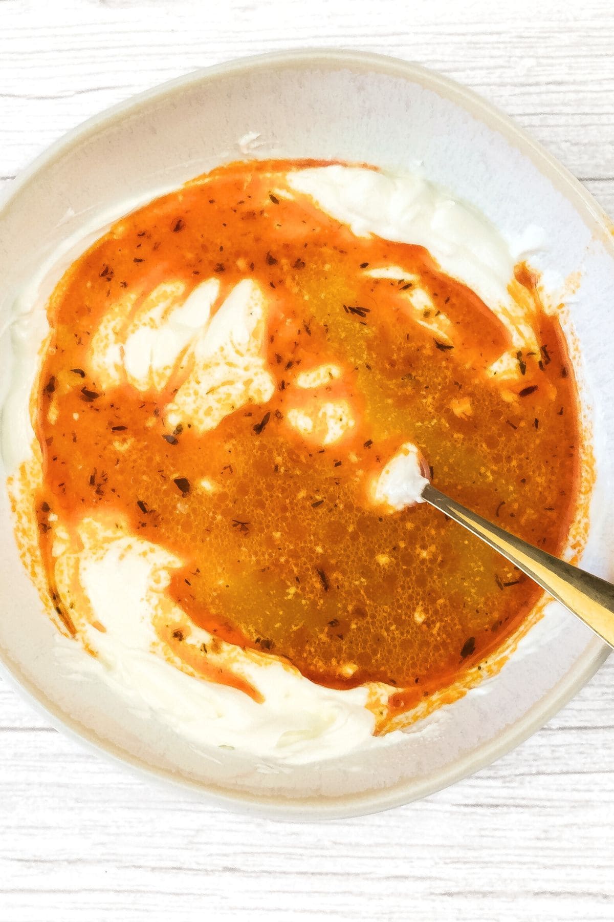 Mixing sour cream and stock in bowl
