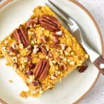 Top down view of a slice of pumpkin baked oatmeal on a plate