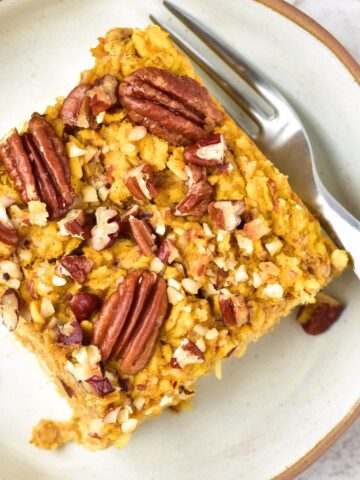 Top down view of a slice of pumpkin baked oatmeal on a plate