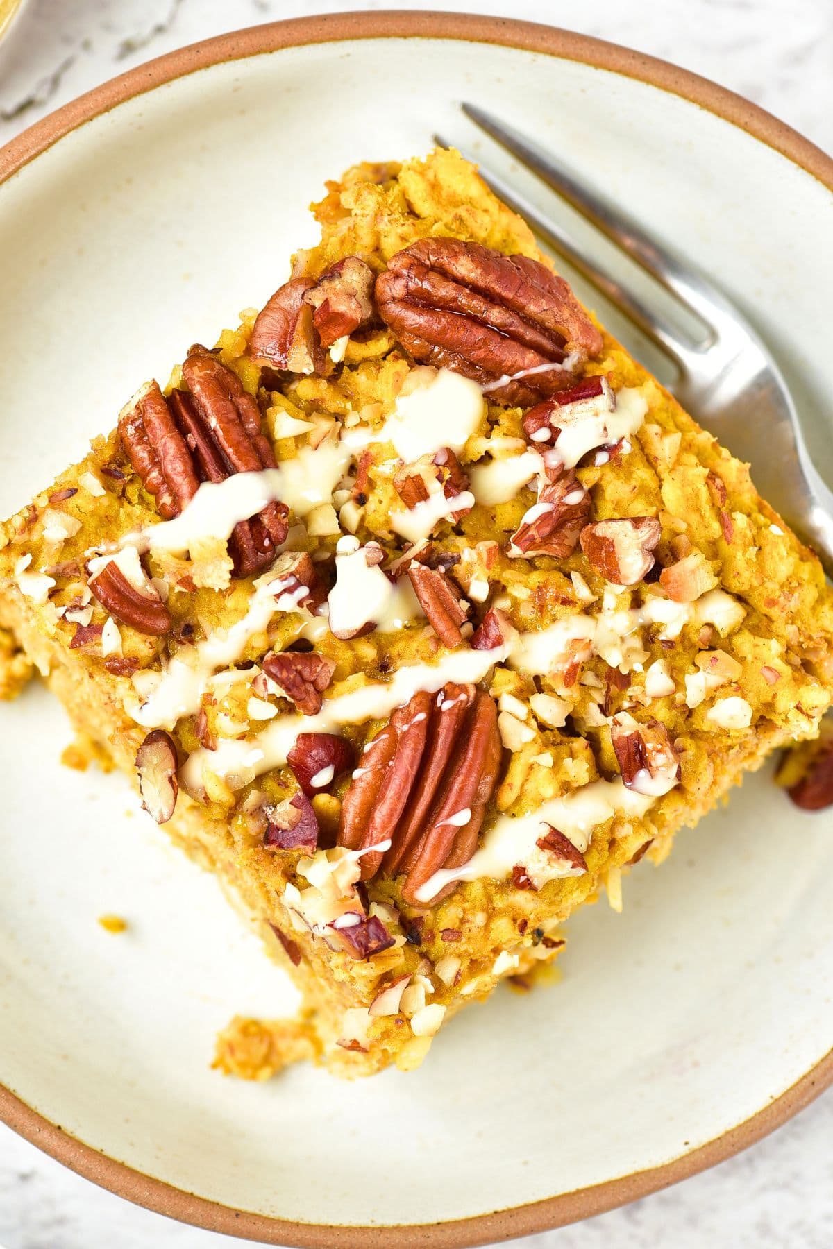 Top down view of a slice of pumpkin oatmeal bake