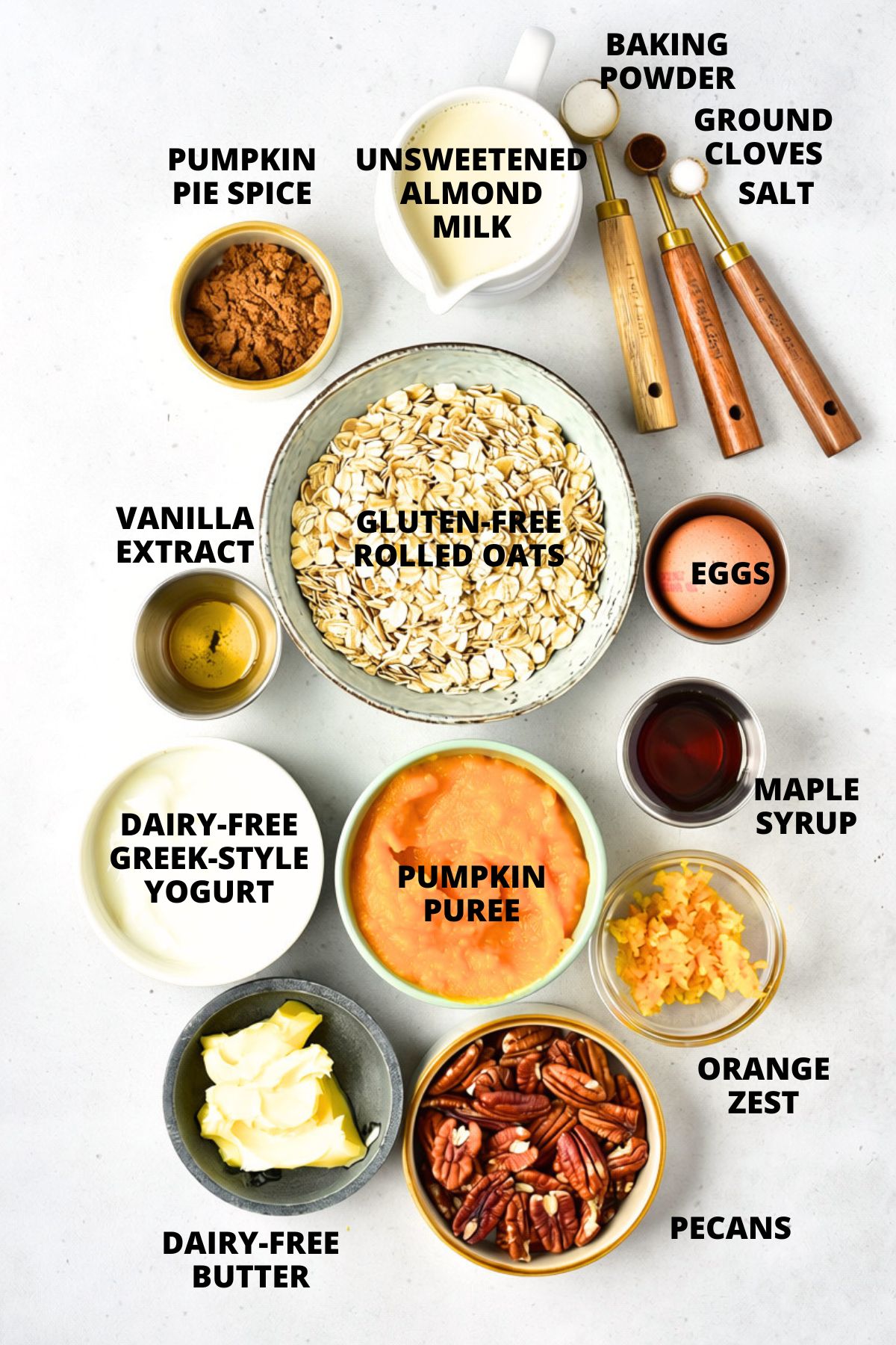 Ingredients for pumpkin baked oatmeal recipe laid out on board.