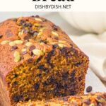 Sliced loaf of pumpkin bread with chocolate chips.
