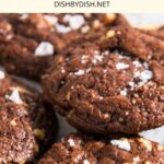 Up close view of chocolate walnut cookies on wire rack.