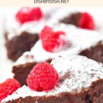 Slices of flourless chocolate cake on plate