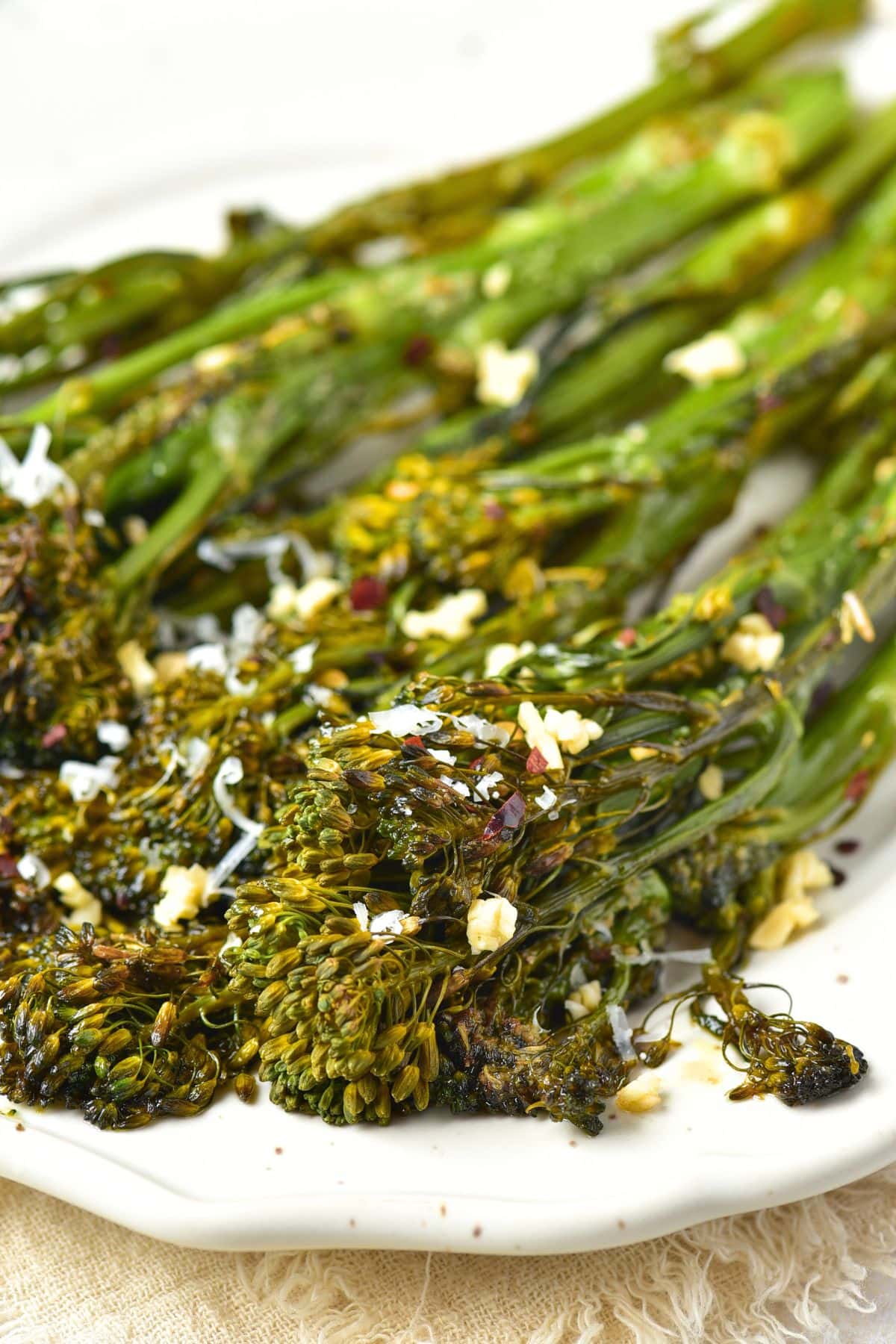 Up close view of roasted broccolini with minced garlic