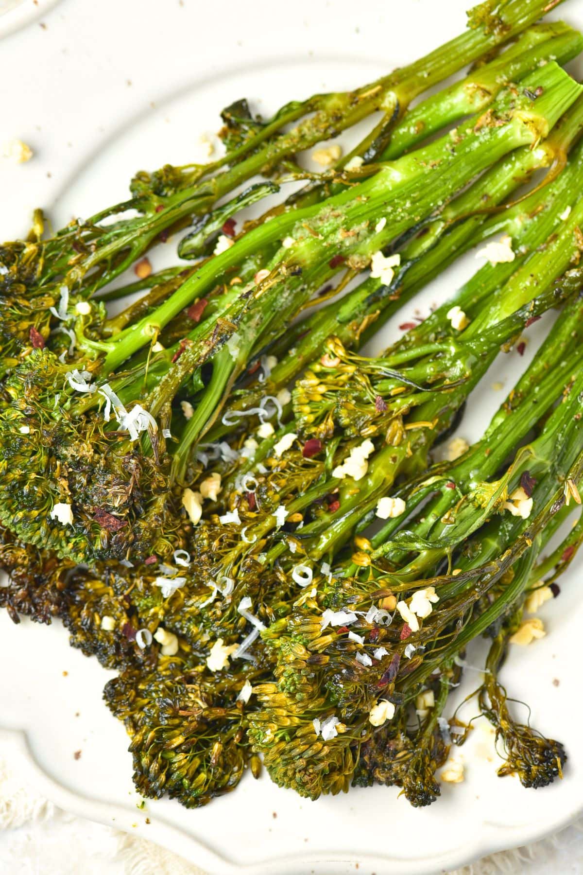 Top down view of roasted garlic broccolini on plate
