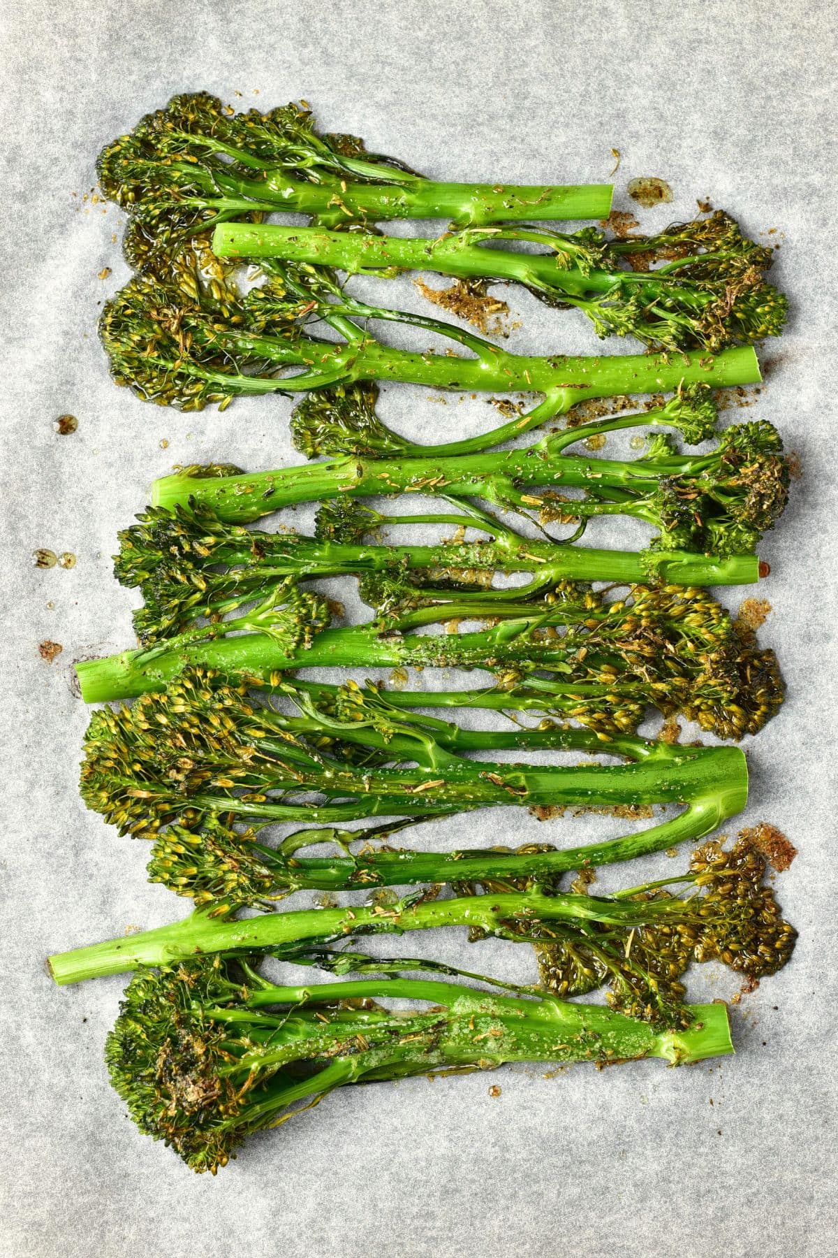Roasted garlic broccolini on parchment paper