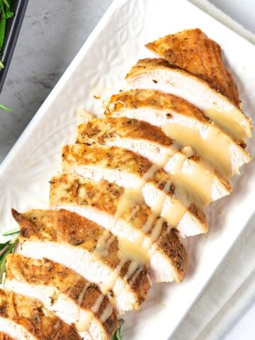 Sliced turkey breast drizzled in turkey gravy