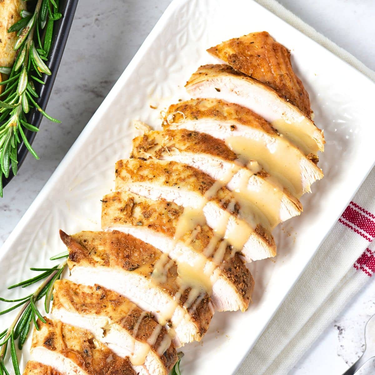 Sliced turkey breast drizzled in turkey gravy