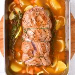 Roasting lamb breast in baking pan.