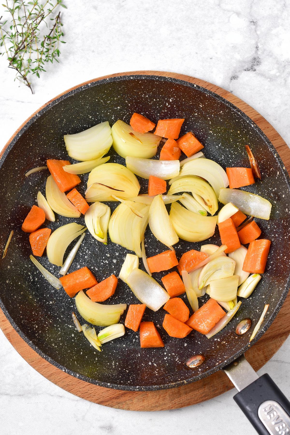 Sautéed veggies in skillet.