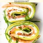 Top down view of cucumber salmon roll ups.