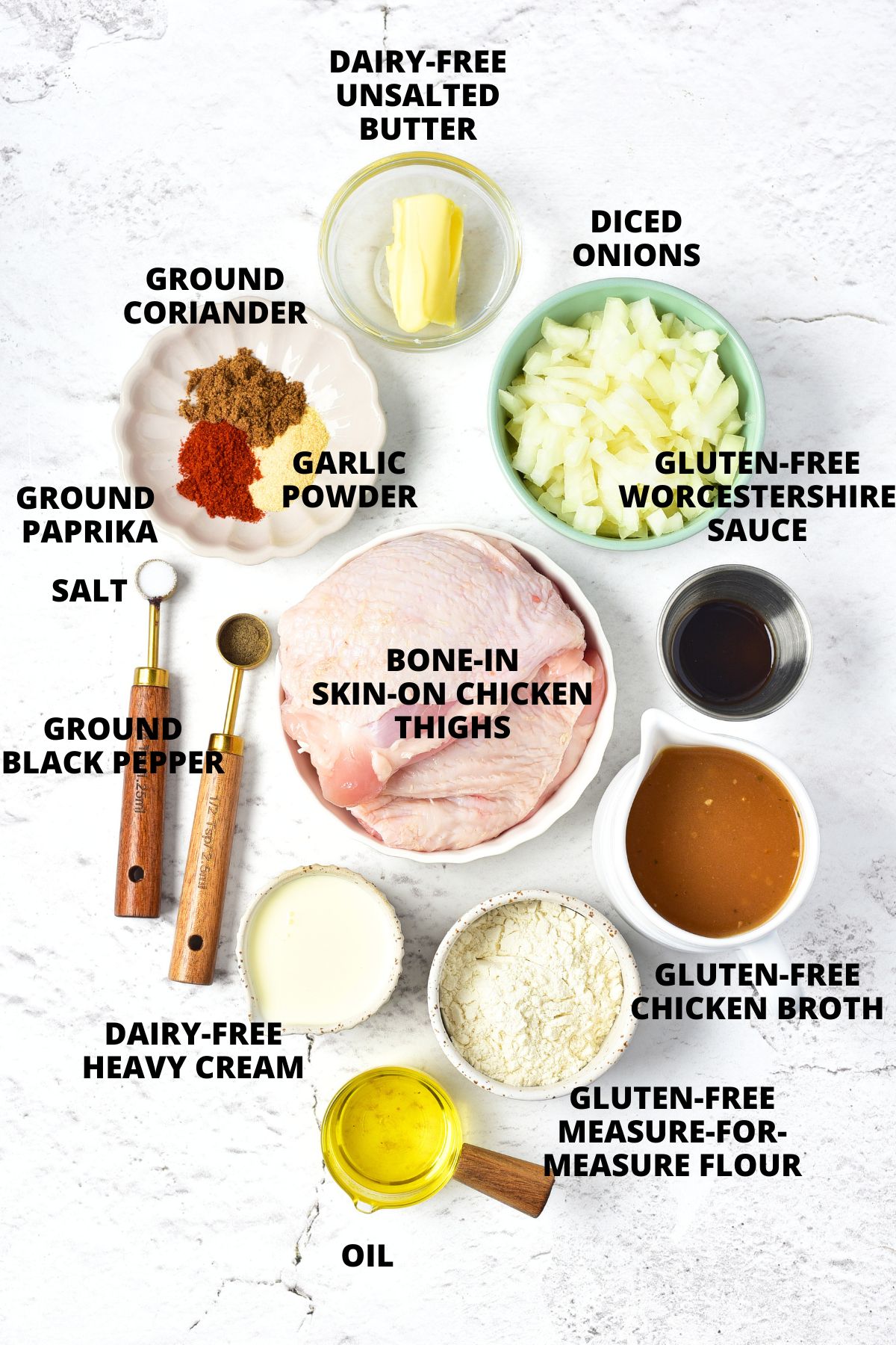 Smothered Chicken Thighs Recipe (Gluten-Free, Dairy-Free) Ingredients for smothered chicken thighs recipe laid out on marble board.