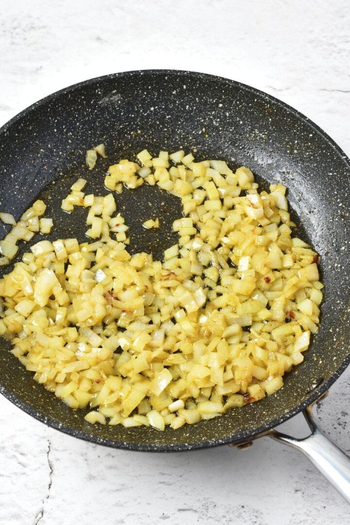 Sautéing diced onions in skillet