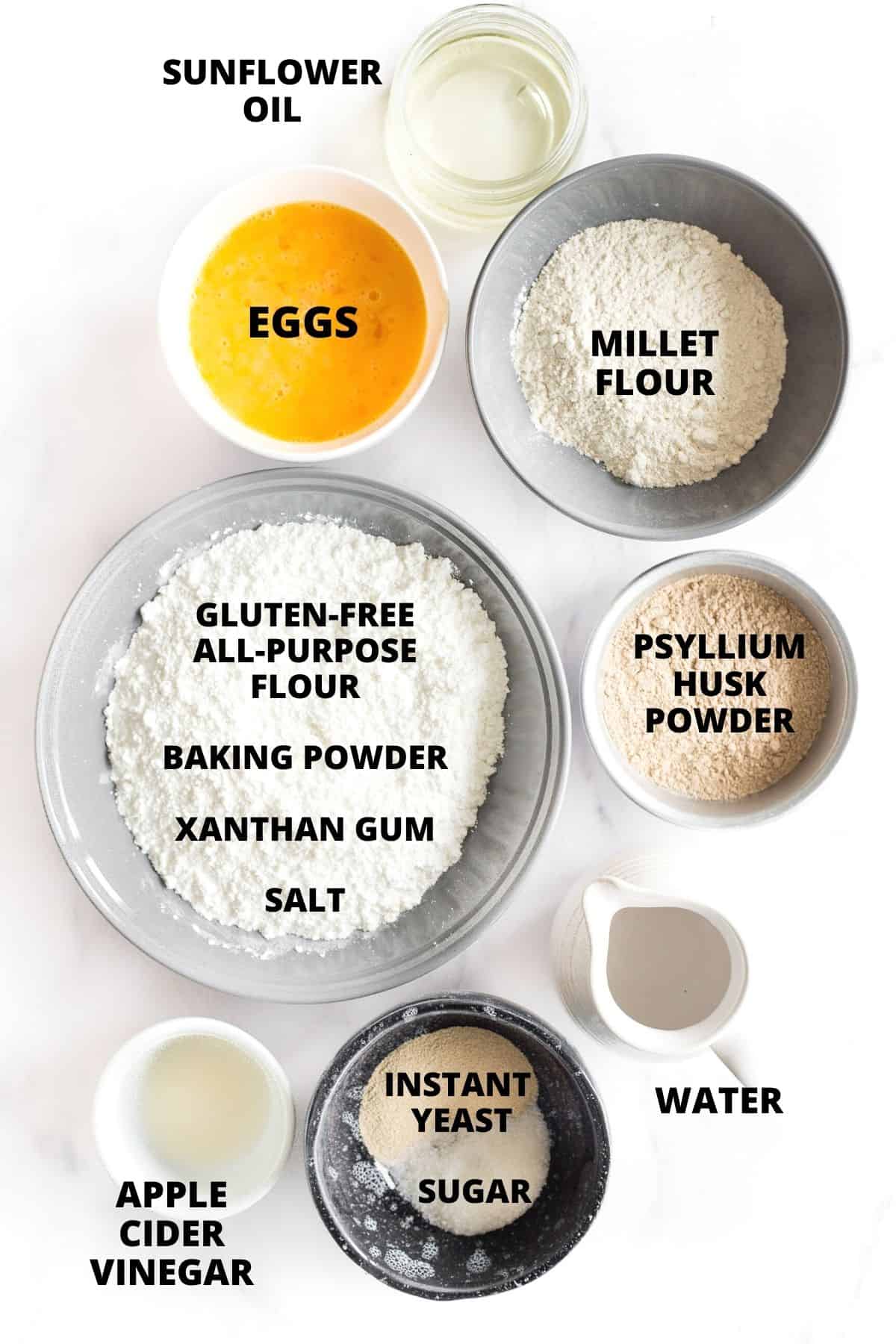 Ingredients for making millet bread recipe laid out on a marble board.
