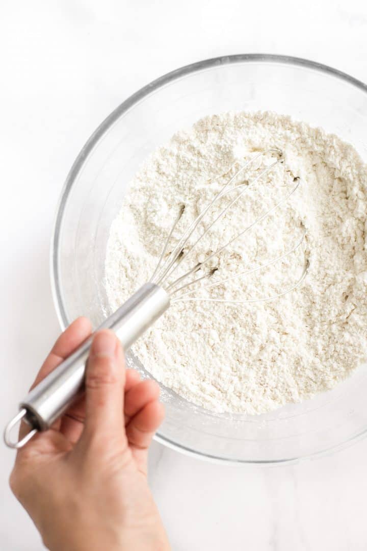Flour mixture in glass mixing bowl.