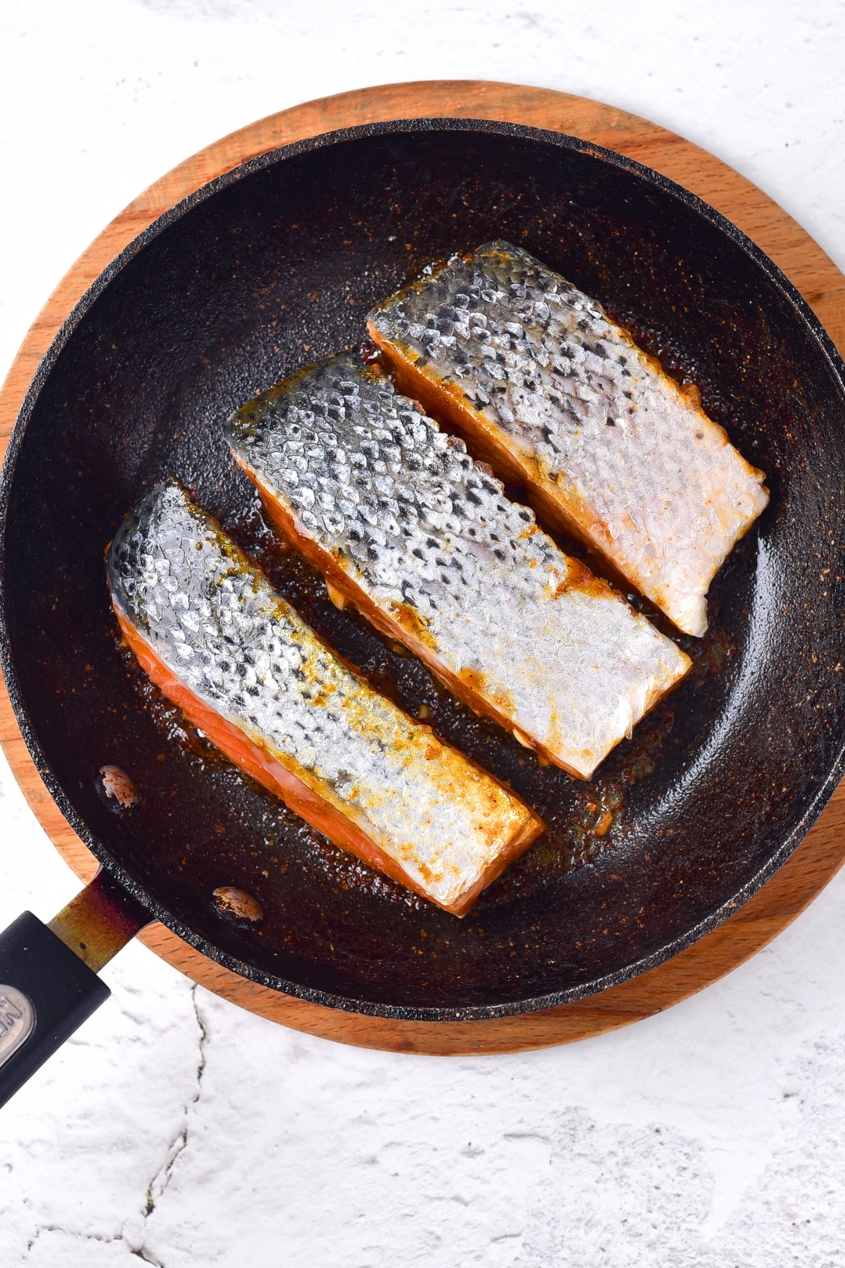 Searing salmon fillets in skillet