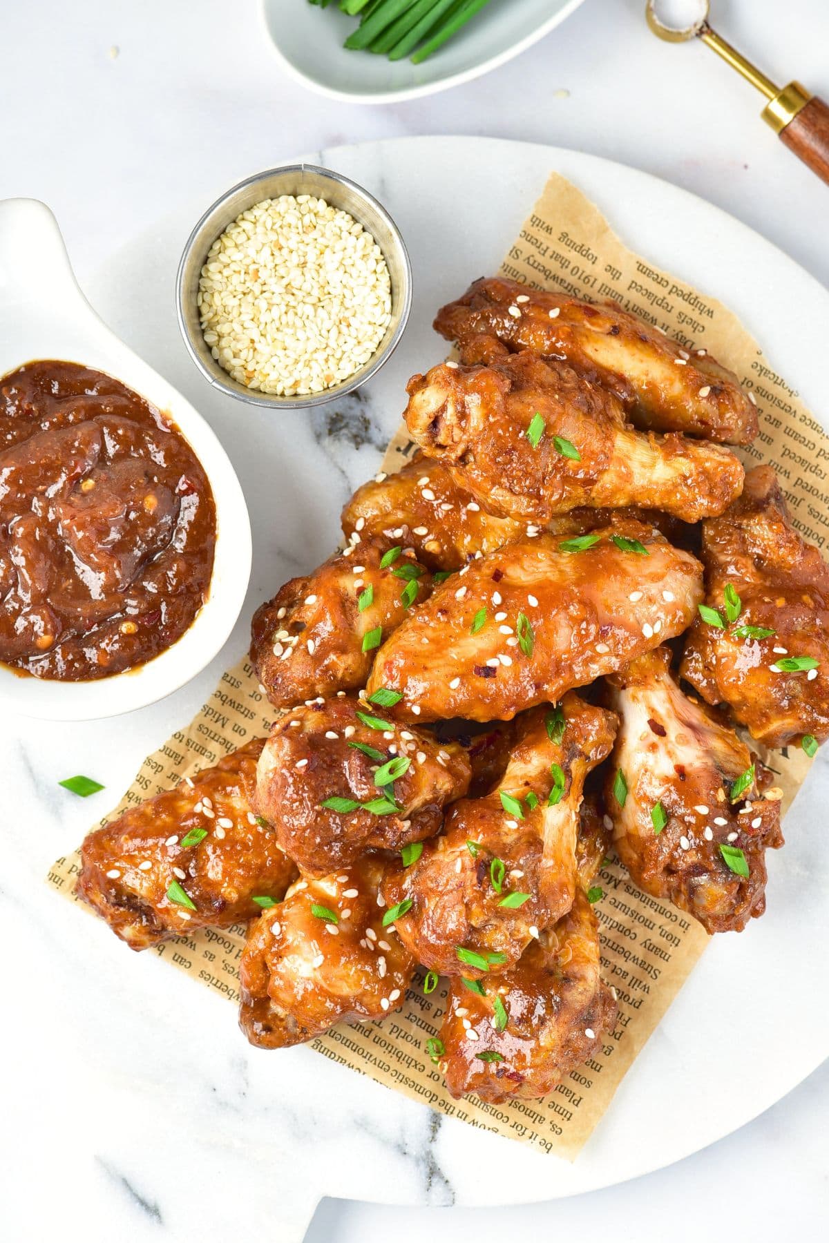 Top down view of Asian sticky wings on marble board