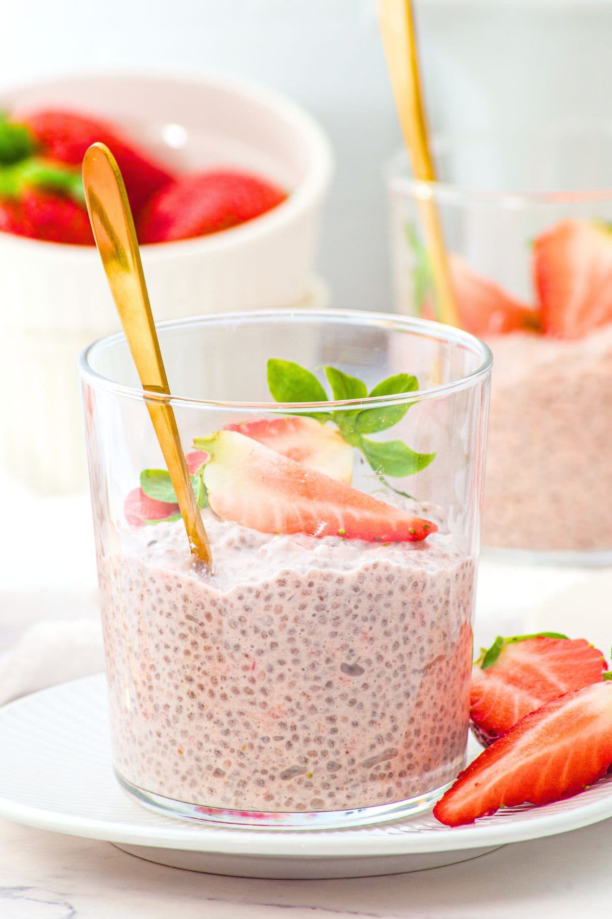 Up close view of a glass with vegan strawberry chia pudding