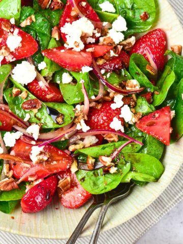 A bowl of strawberry spinach feta salad