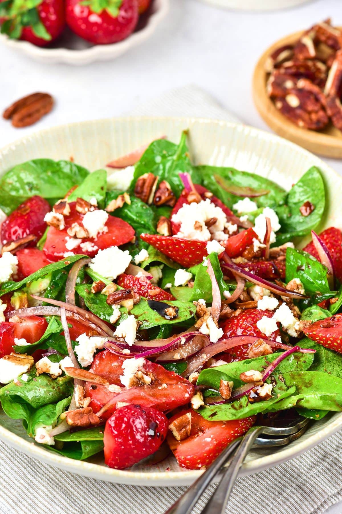 A bowl of strawberry spinach feta salad