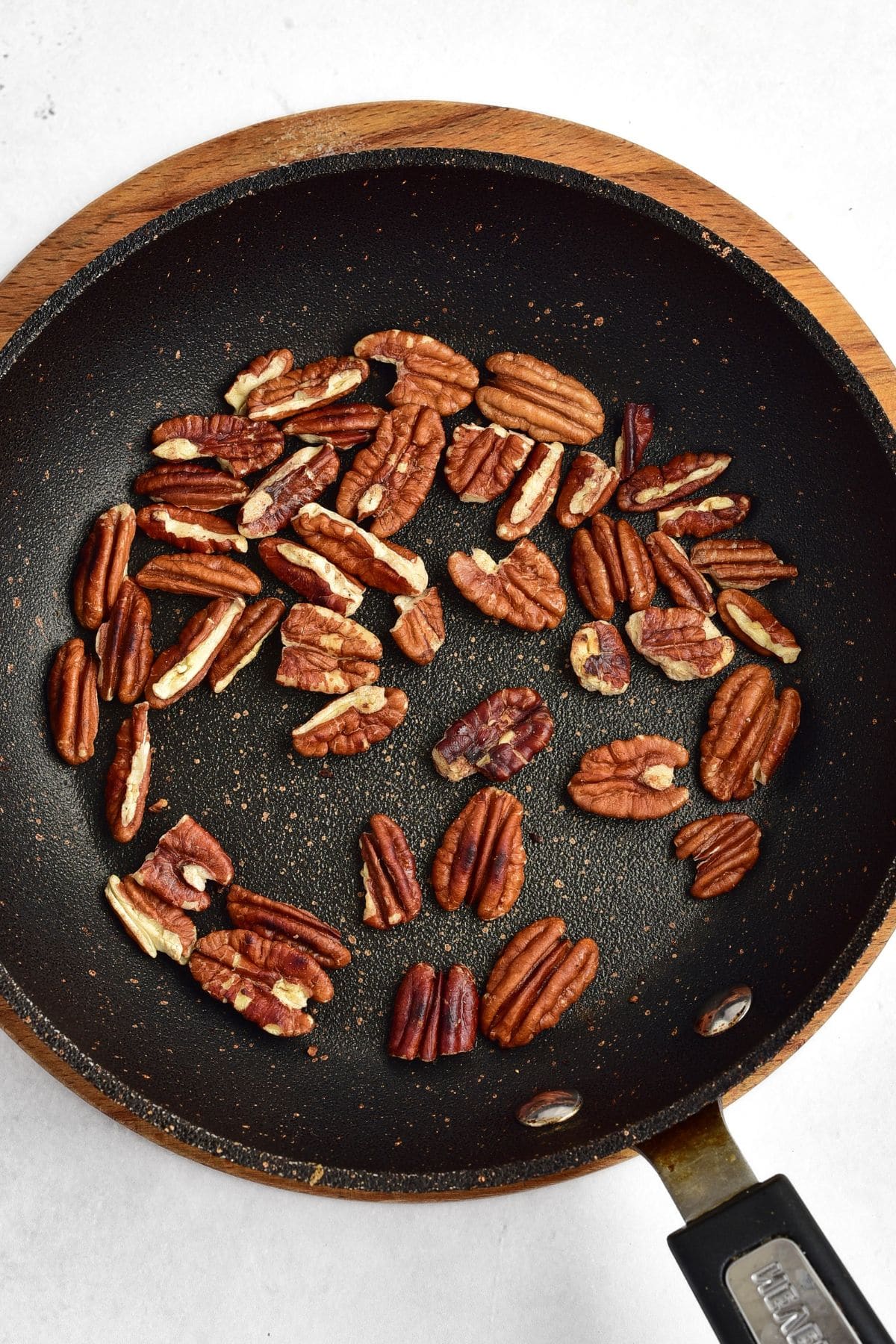 Toasted pecans in skillet
