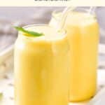 Glasses of mango shake on serving tray.