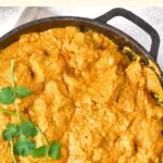 Top down view of skillet with butter chicken