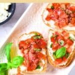 Gluten-free bruschetta on serving plate.