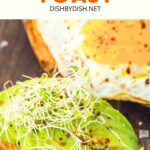 Sliced sweet potatoes topped with avocado and microgreens