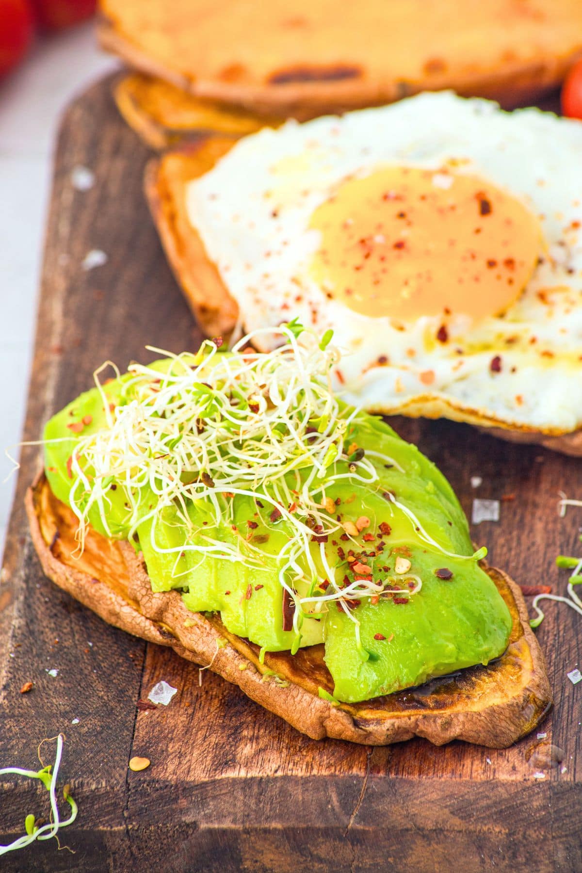 Sweet potato avocado toast on wooden board