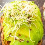 Sliced avocado on sweet potato toast