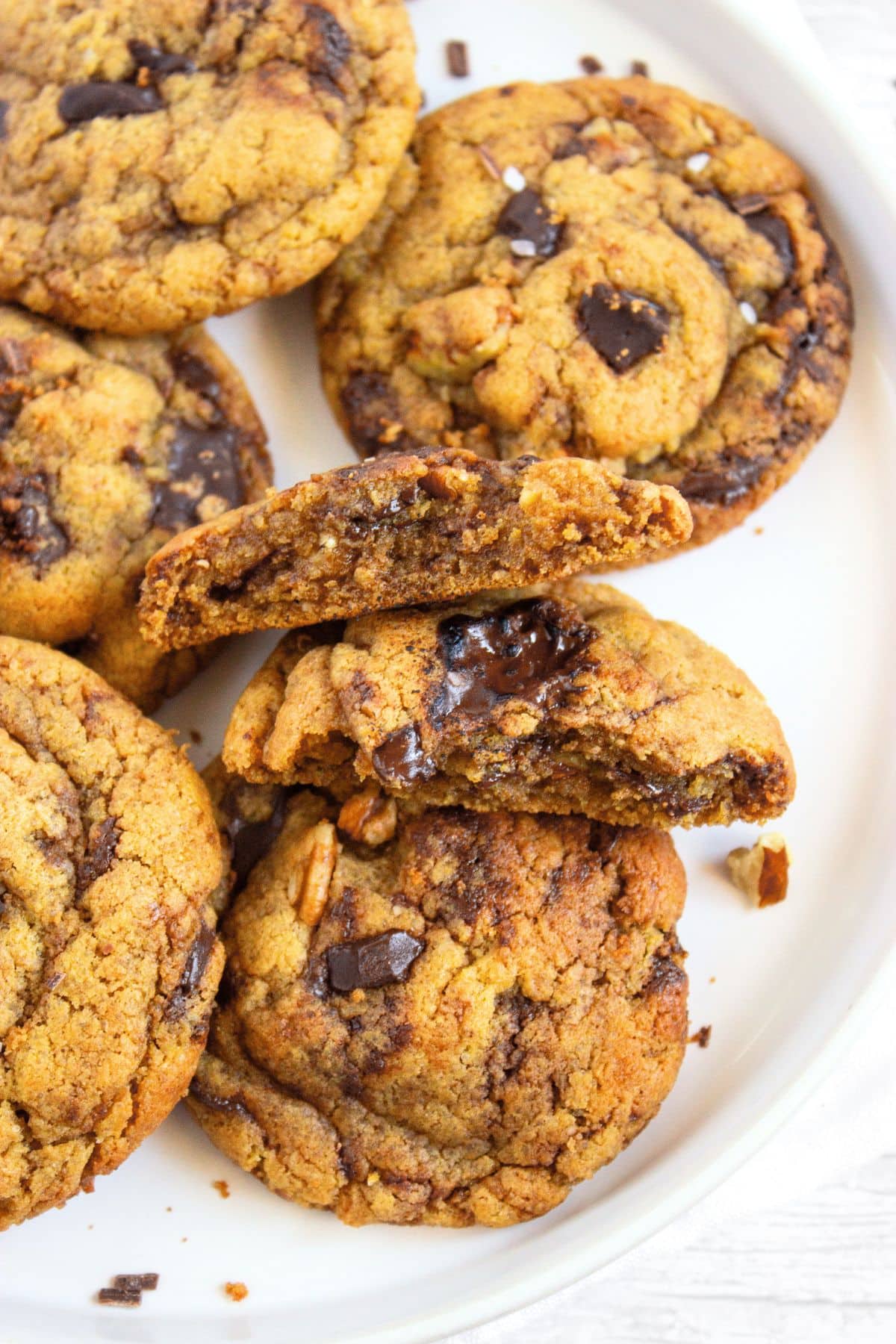 A plate of half-eaten tahini chocolate chip cookies.
