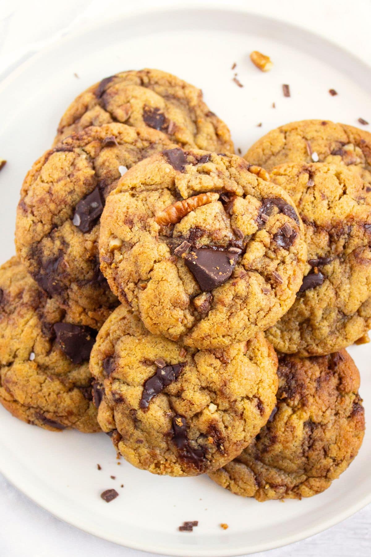 Top down view of plate of chocolate chip tahini cookies.
