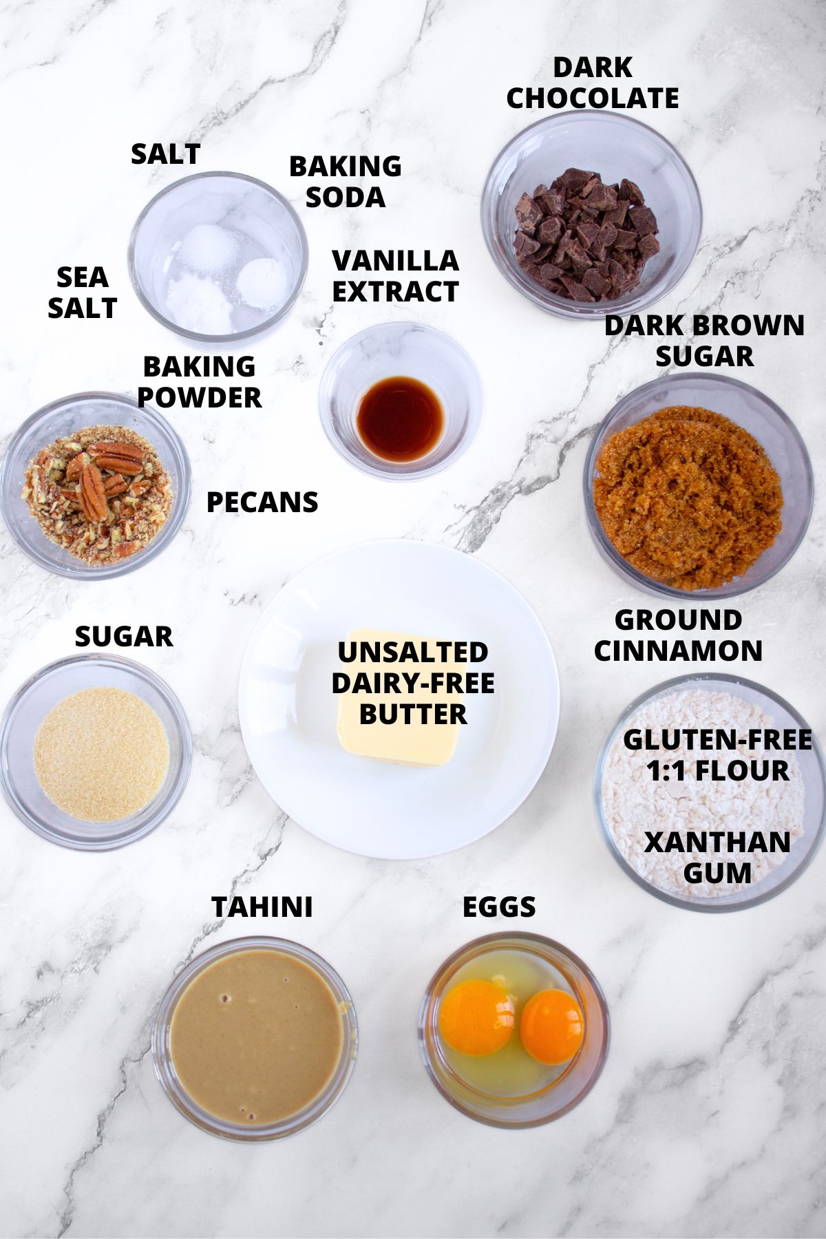 Ingredients for tahini chocolate chip cookies recipes on marble board.